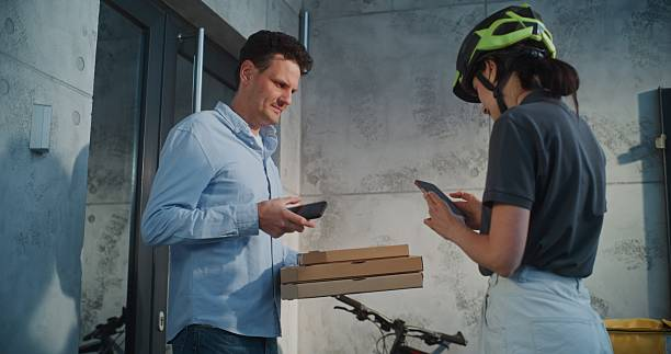 Rider confirming delivery with receiver
