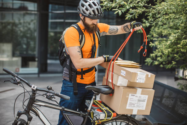 Urban bike courier ready to pick up a parcel